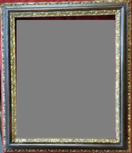 Bella cornice in legno tinto scuro e doppia modanatura interna ed esterna intagliata e dorata. Roma XVII° sec. luce cm.44x54 est.59x69